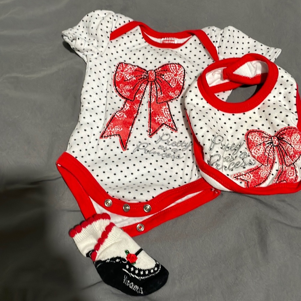 Girls onesie, bib and socks outfit.